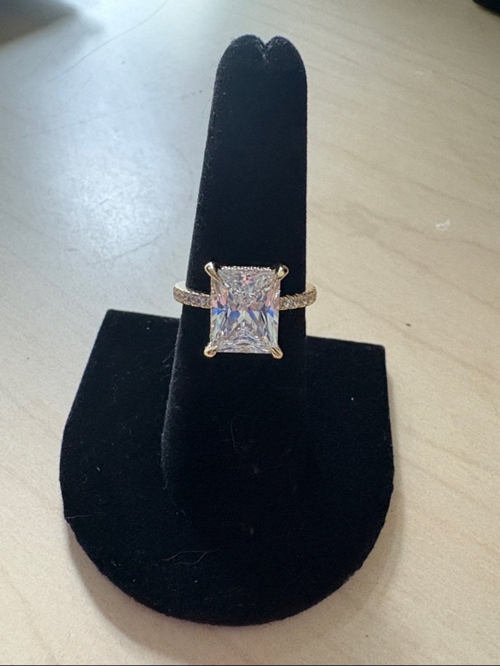 Elegant Gold-Tone Ring with Large Clear Stone and Pavé Band